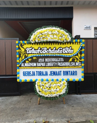 Papan Bunga Duka di Ayuhulalo